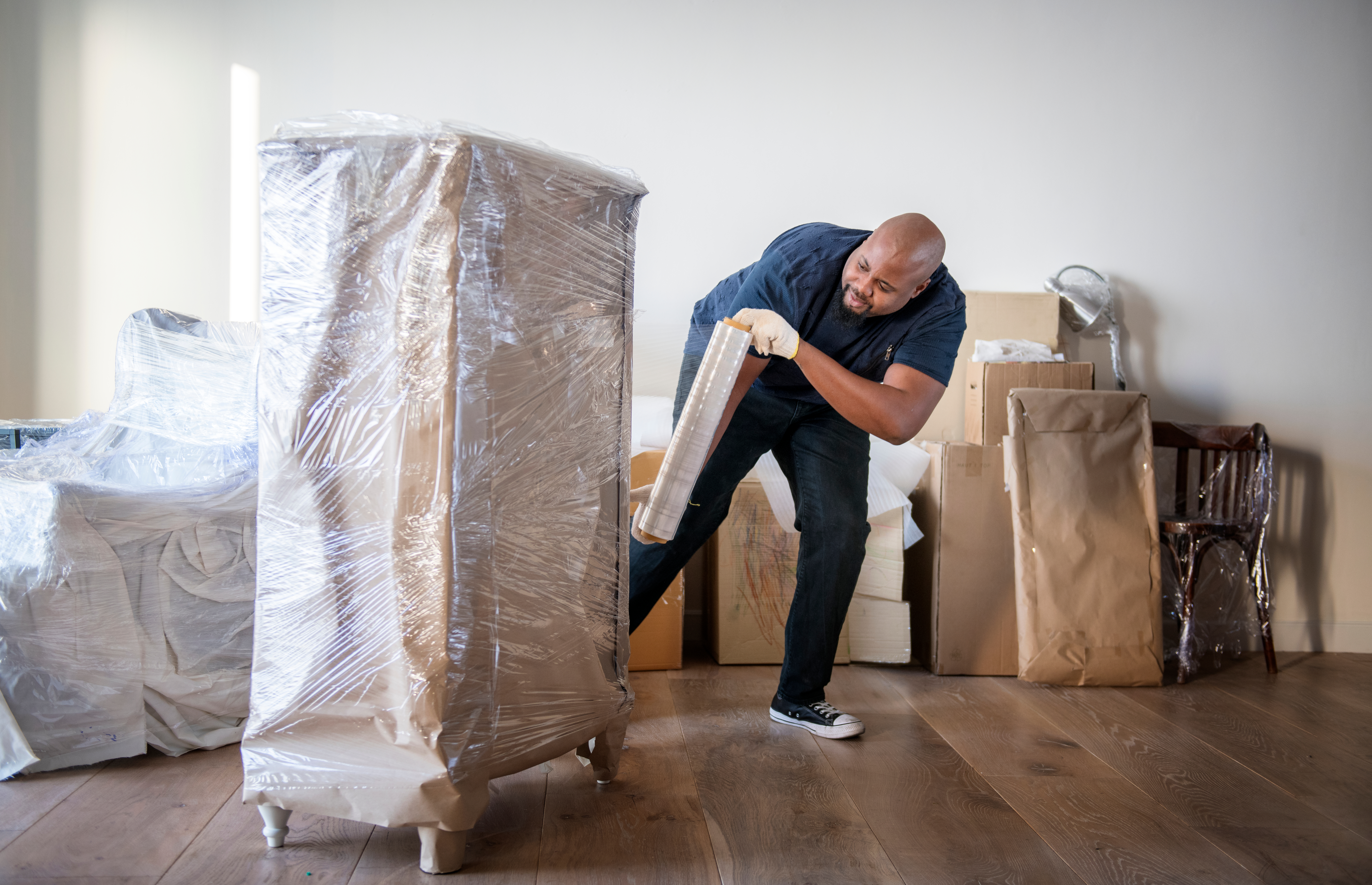 Professional packer and mover preparing for a long distance relocation.