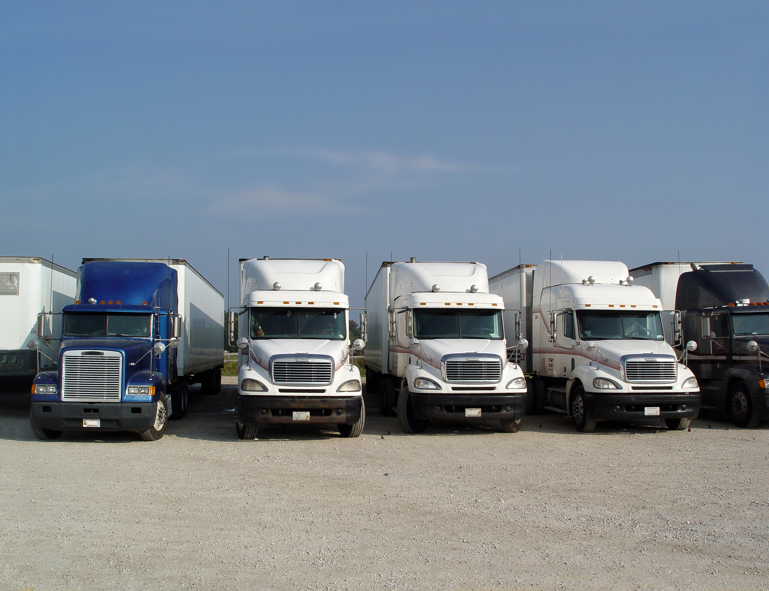 Truck stop in california, resting place, a row of trucks parked .jpg